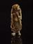 Ivory netsuke in the form of a man holding a Taoist fly-whisk