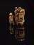 Netsuke in form of man carrying staff and fan