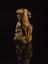 Netsuke in form of skeleton with Tanuki the badger holding peach