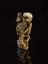 Netsuke in form of skeleton holding fan and Tanuki the badger