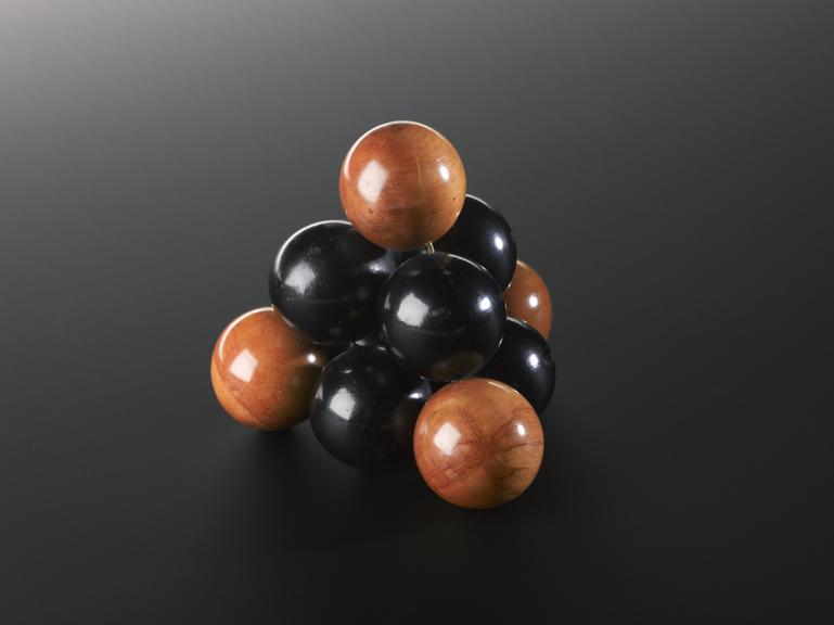 Crystal structure represented by an arrangement of ten spheres