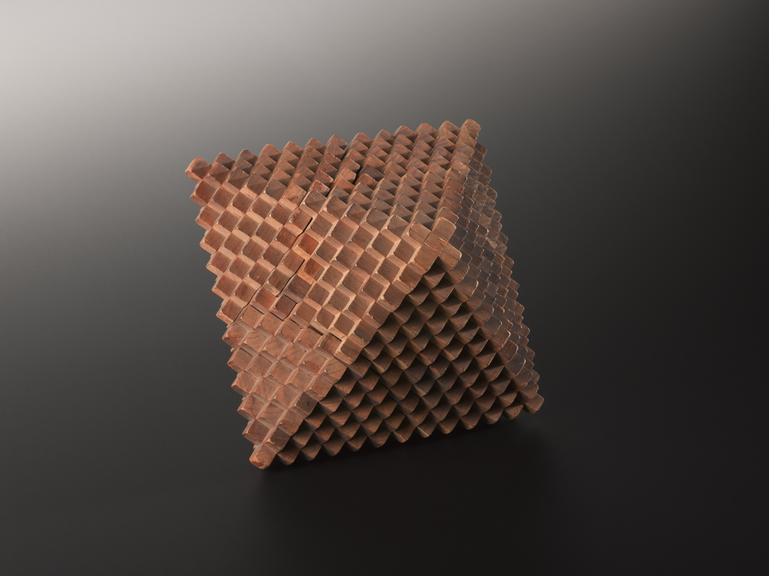 Crystal structure represented by a wooden regular octahedron