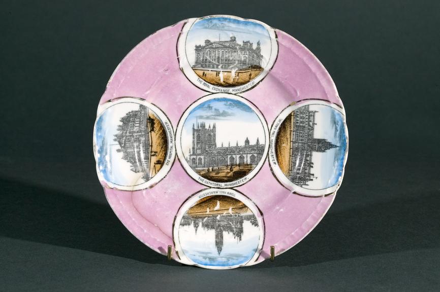 Souvenir plate with printed views of four Manchester buildings