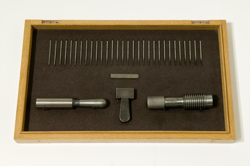 Box of taps, wrenches, die holder and cutters made by J