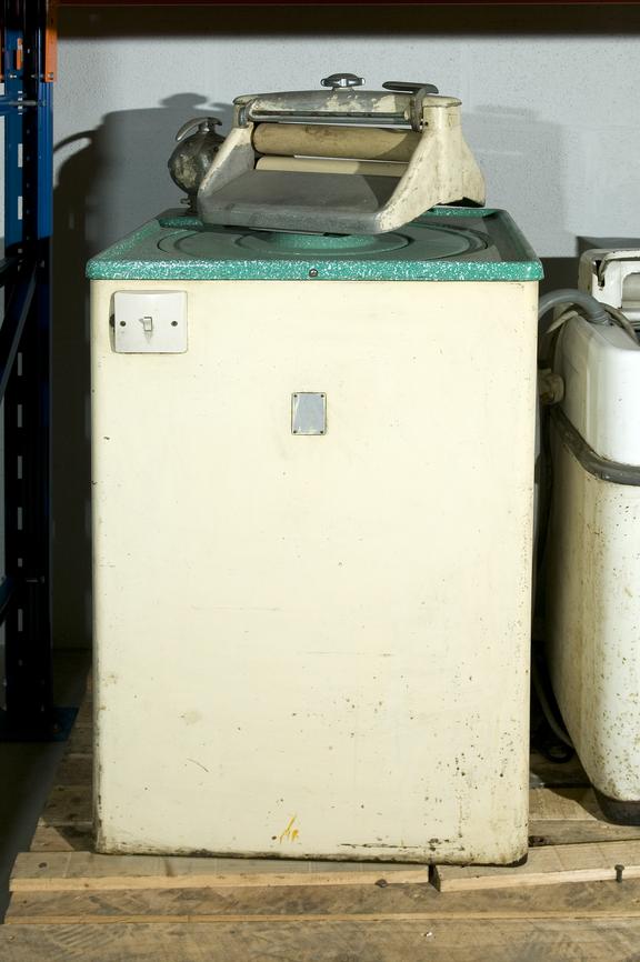 Top-loading electric washing machine with mangle made by the