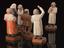 Wooden satues depicting various different medical professions