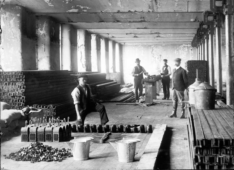 Works photographic negative of men in store, Stalybridge.