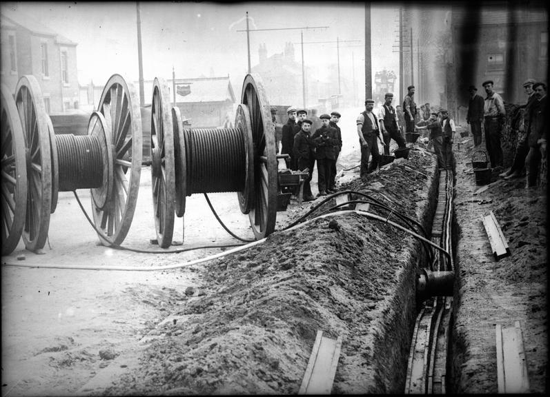 Works photographic negative of cable laying pipes