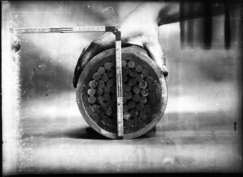 Works photographic negative of cross-section of 5 inch cable