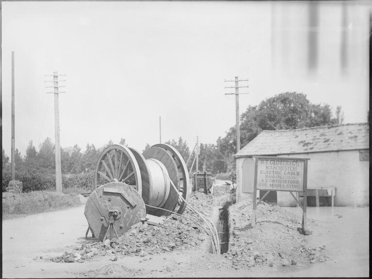 Works photographic negative of cable laying in rural road