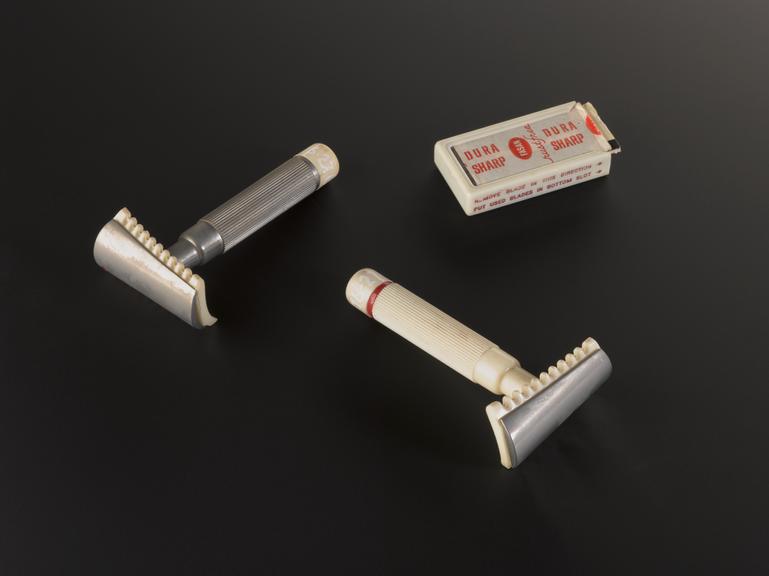 Two  safety razors made by Fasan having curved blade holder design