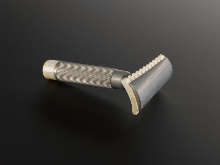 Two  safety razors made by Fasan having curved blade holder design