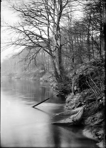 Works photographic negative of cable emerging from open water