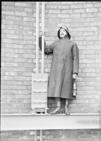 Works photographic negative of a vertical cable in cleat on pit