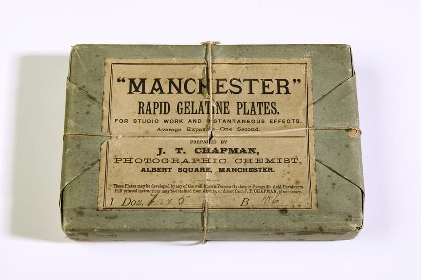 A box of 12 'Manchester' dry plate negatives by J.T