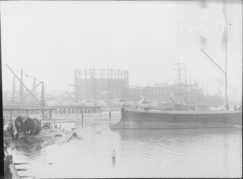 Works photographic negative of cable drums in dock