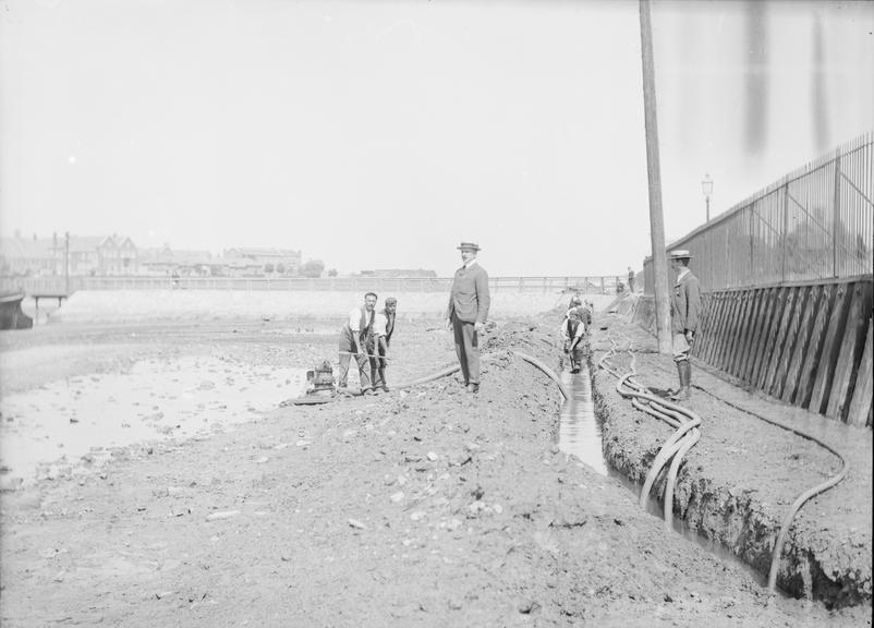 Works photographic negative of cable in trench, Whale Island