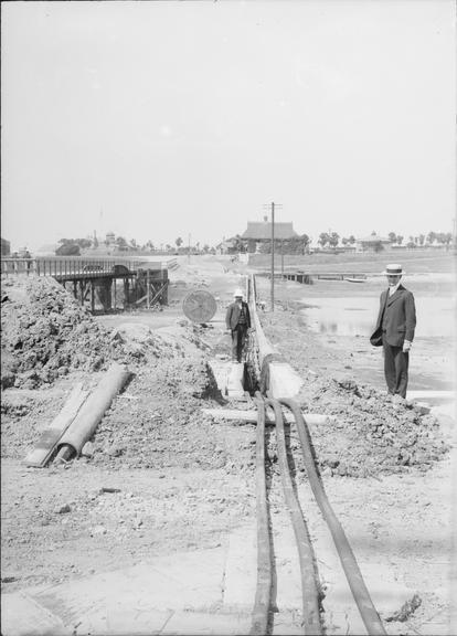 Works photographic negative of cables emerging from trench