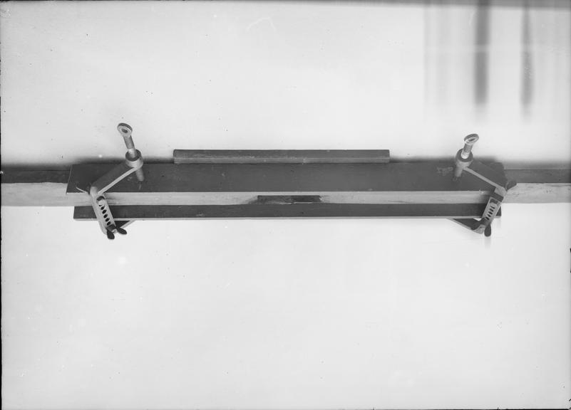 Works photographic negative of plates clamped to trough