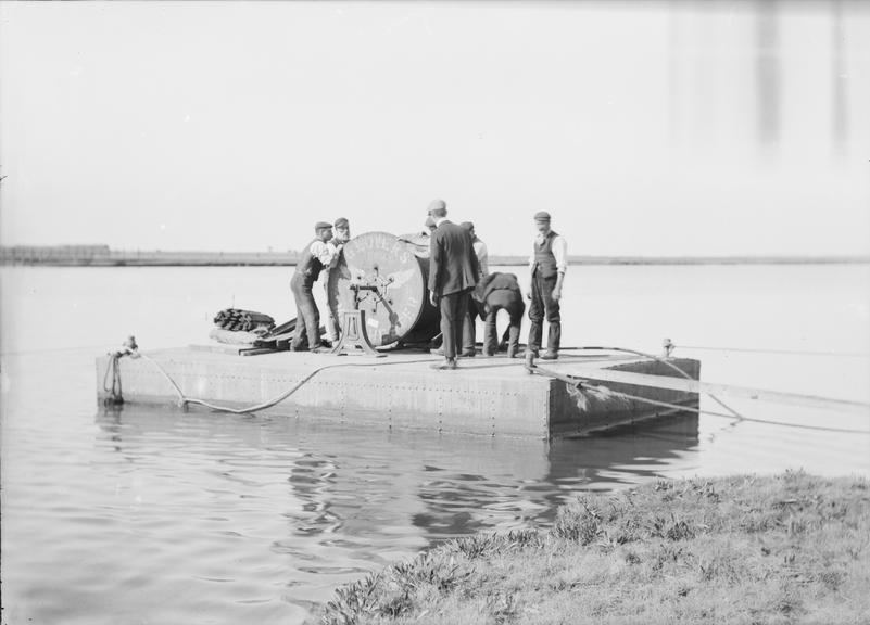 Works photographic negative of men on raft