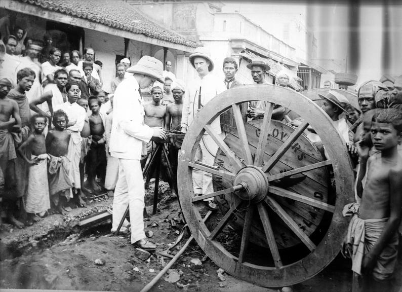 Works photographic negative of men testing cable, Madras, India