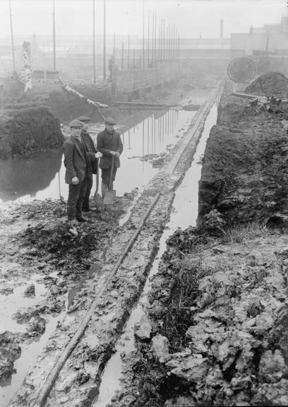 Works photographic negative of cable in flooded area