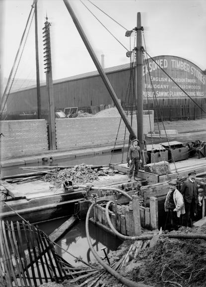 Works photographic negative of cable laying near canal