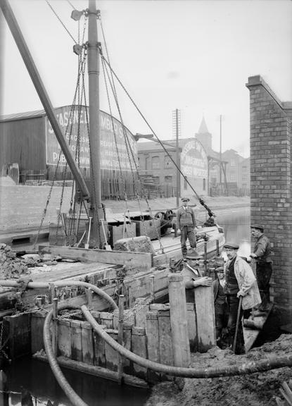 Works photographic negative of cable laying near canal