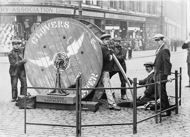 Works photographic negative of men and cable drum, Piccadilly