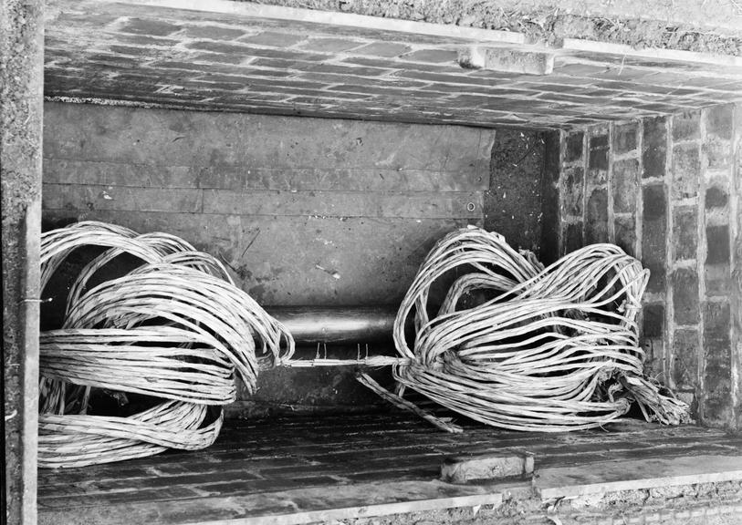 Works photographic negative of cable ends in pit