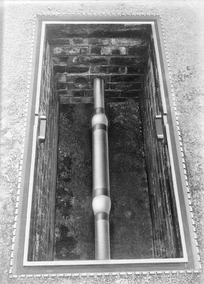 Works photographic negative of cable in pit