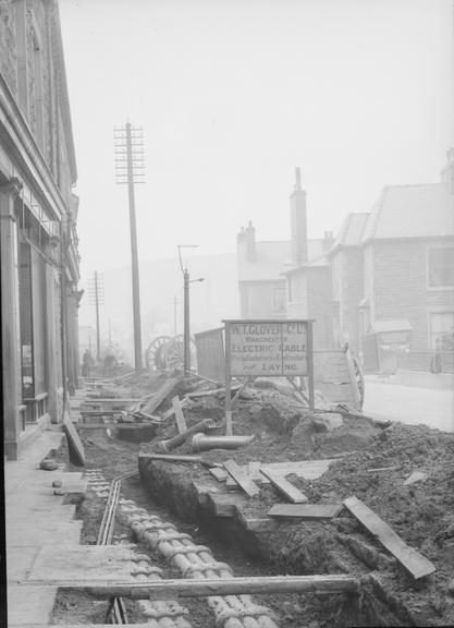 Works photographic negative of small cable in troughing