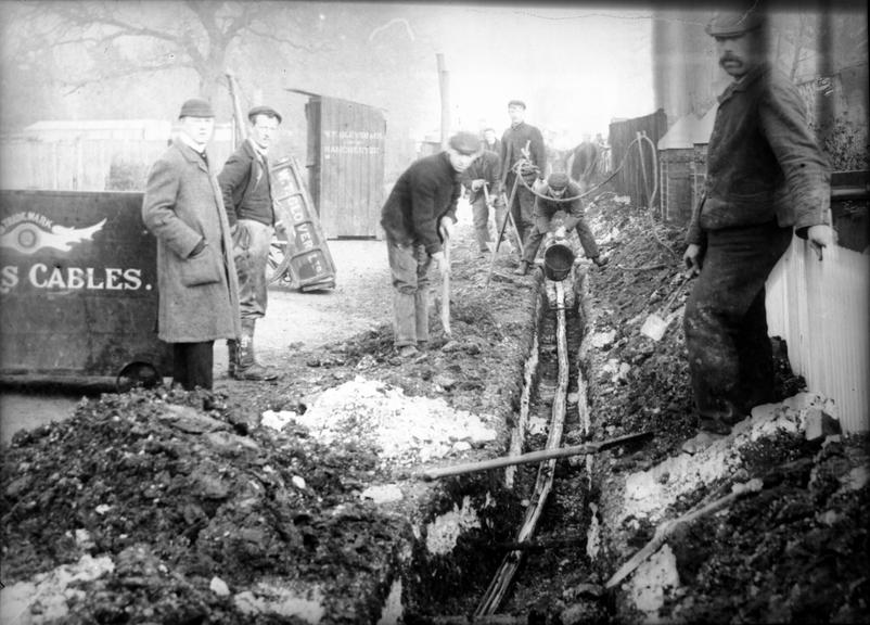 Works photographic negative of pitch being poured into