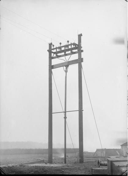 Works photographic negative of rows of poles with terminators