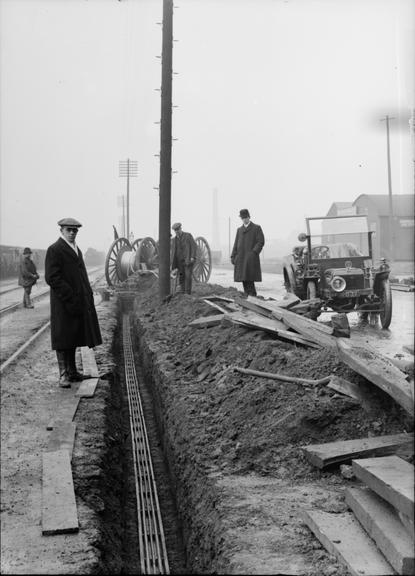 Works photographic negative of cables in trench