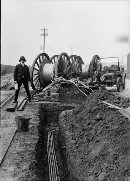 Works photographic negative of cables in trench