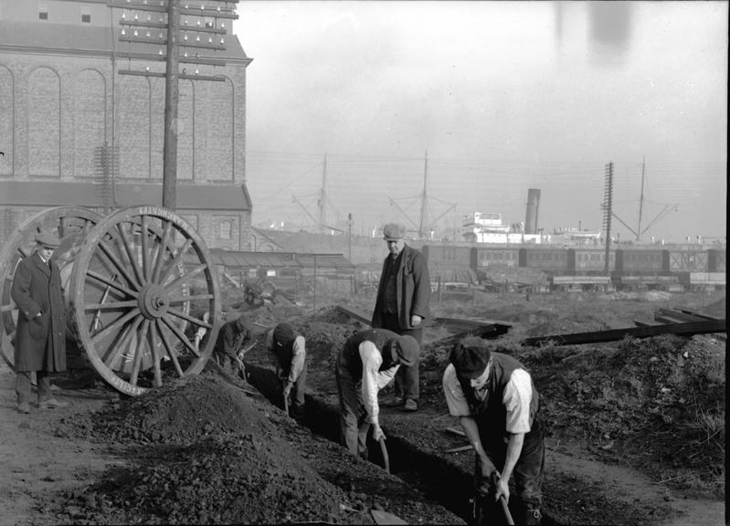 Works photographic negative of men working in trench