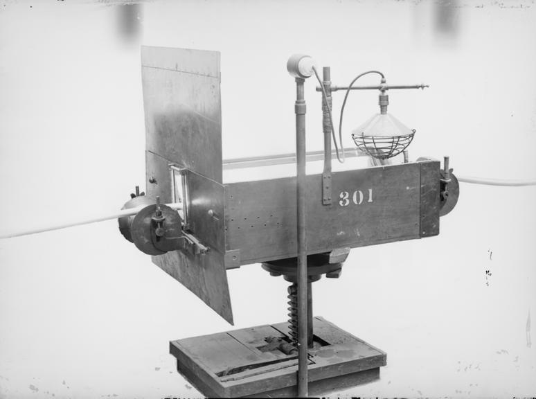 Works photographic negative of mirror raising apparatus