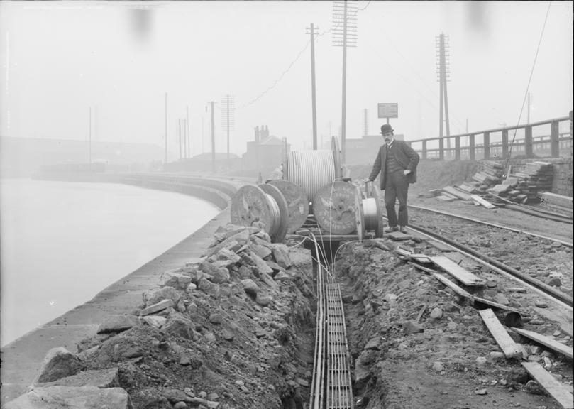 Works photographic negative of cables in troughing, Pomona Dock