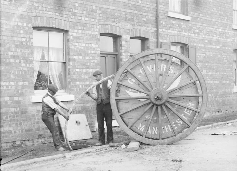 Works photographic negative of men with cable drum, Pemberton