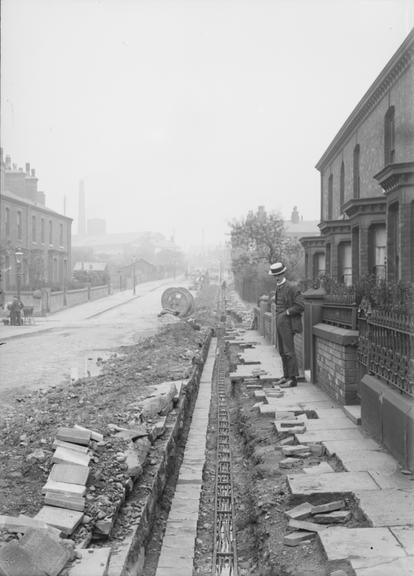 Works photographic negative of trench with cable troughs