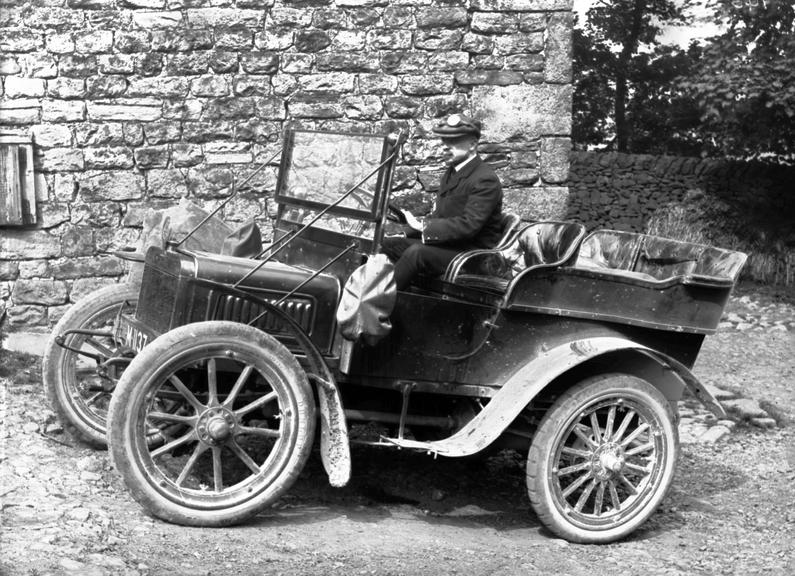 Works photographic negative of WT Anderson in Royce car, Arksey