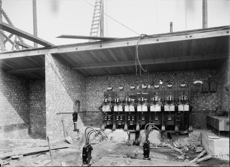 Works photographic negative of row of circuit breakers