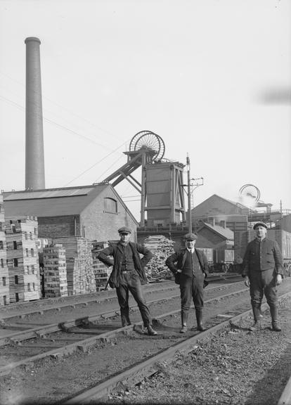 Works photographic negative of men on railway tracks