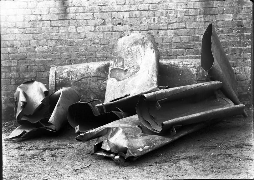 Works photographic negative of damaged sheet metal