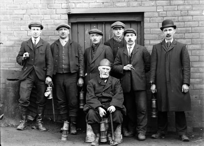 Works photographic negative of men with miner's lamps