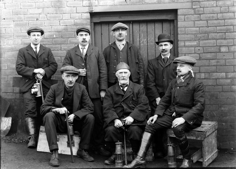 Works photographic negative of men with miner's lamps