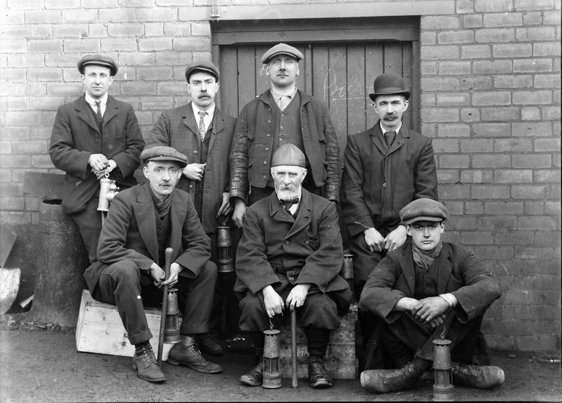 Works photographic negative of men with miner's lamps