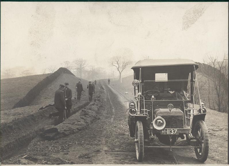 Works photographic negative of men digging trench