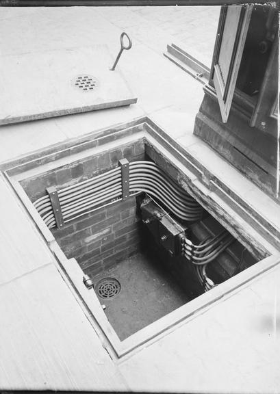 Works photographic negative of cables in manhole, Bacup